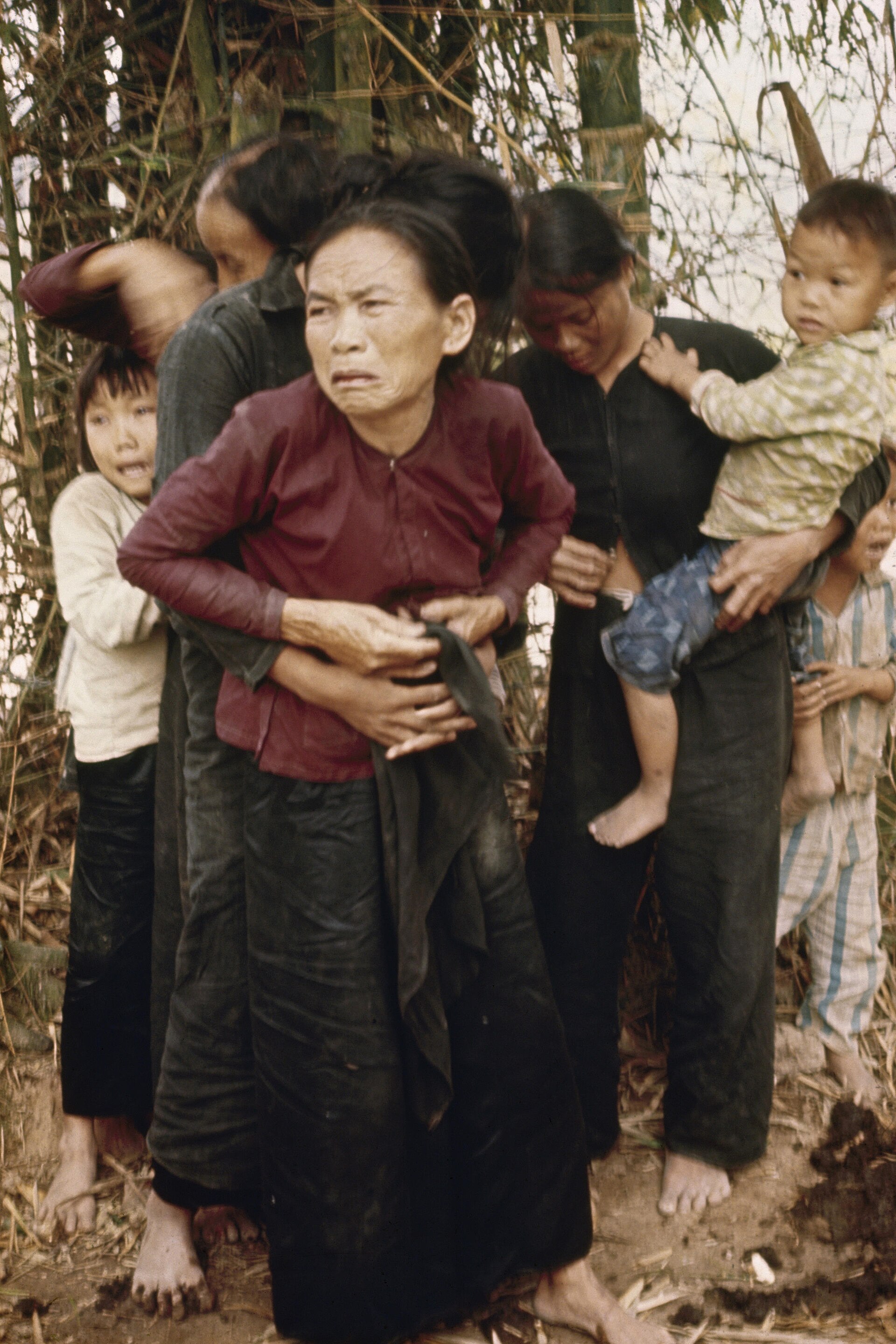 Women and children huddle in Mỹ Lai. An operation against communist guerrillas ended in a civilian massacre during the war over Vietnam’s political control and reunification.
